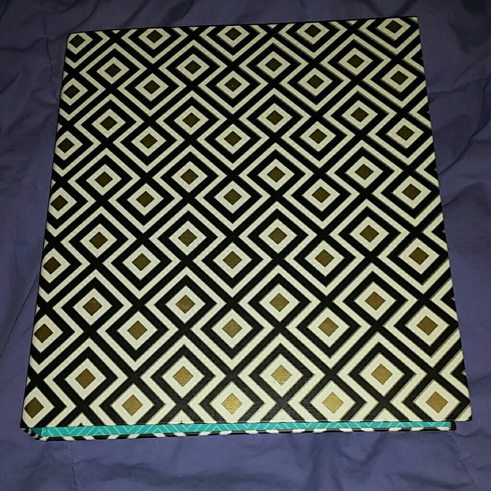 Black, white, and gold binder